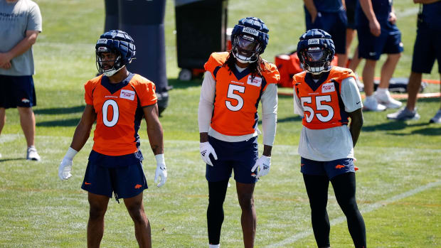 Denver Broncos linebacker Jonathon Cooper (0) and linebacker Randy Gregory (5) and center Kyle Fuller (55) during training camp at Centura Health Training Center.
